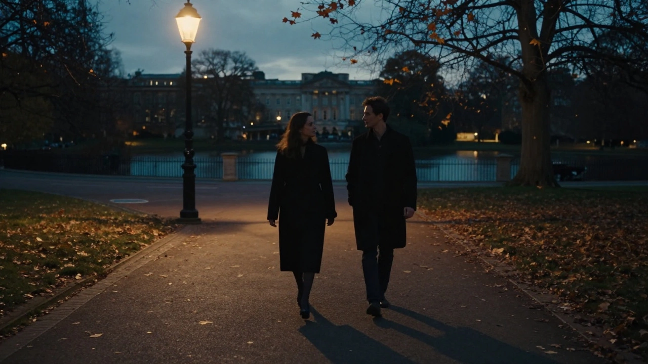 A man and woman walking peacefully through Hyde Park at dusk, autumn leaves swirling around them under soft streetlamps.